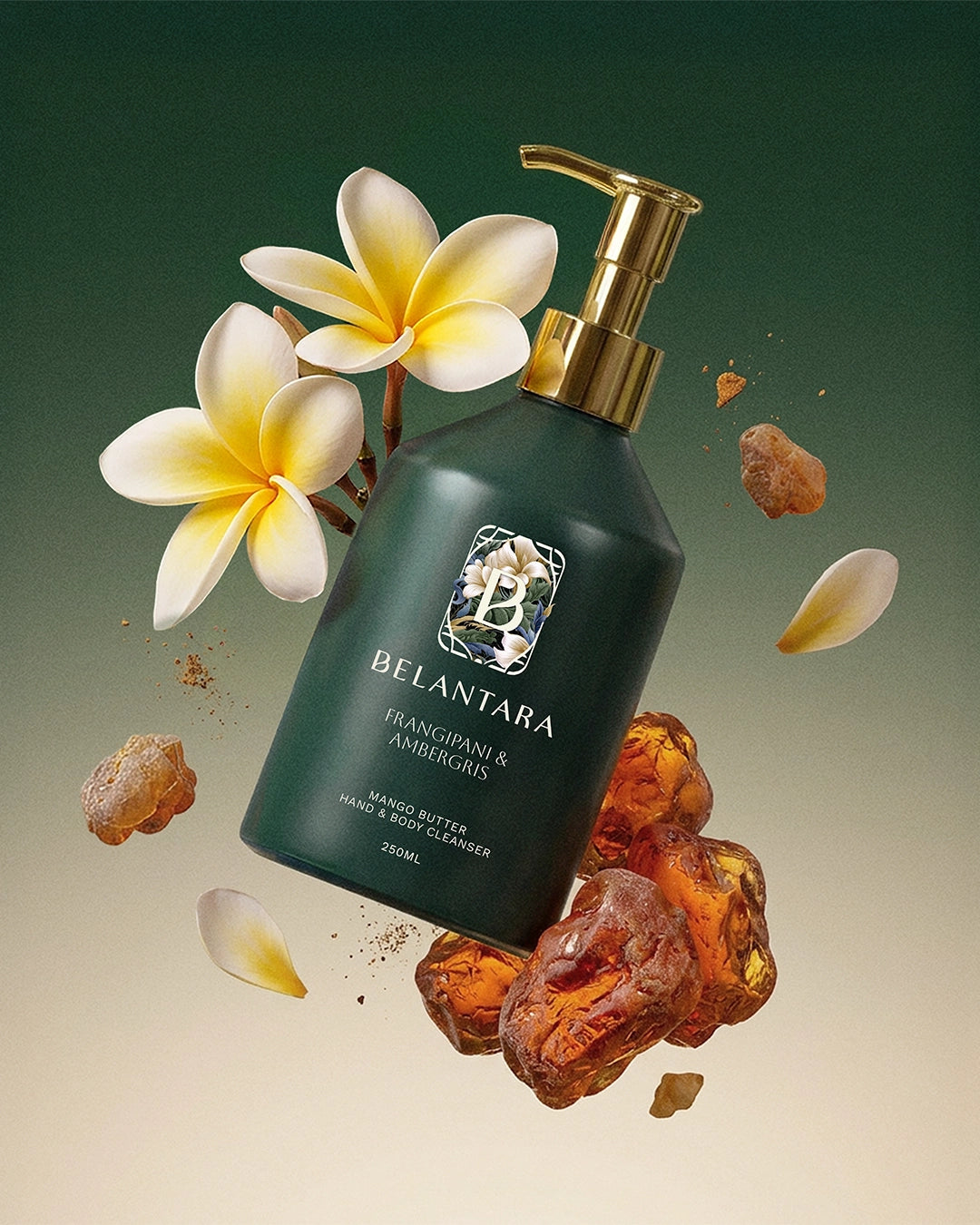 Belantara frangipani & ambergris hand & body cleanser with flowers and amber crystals on a dark green gradient background.