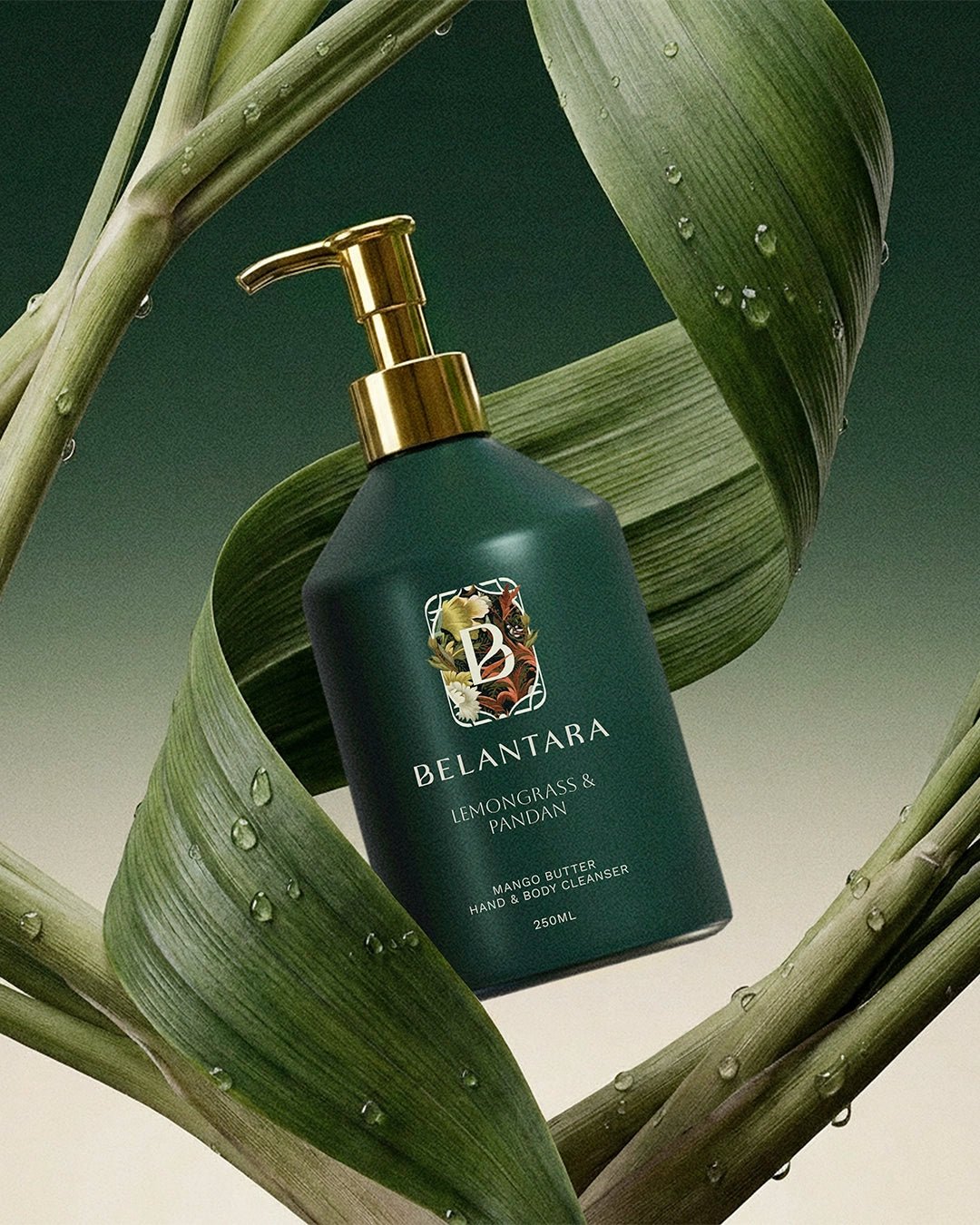 Belantara lemongrass and pandan hand & body wash with pandan leaves and lemongrass in the background.