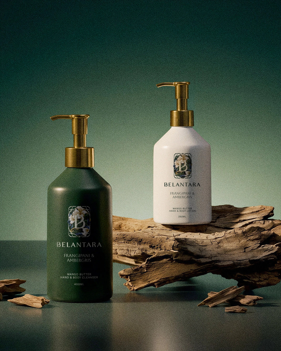 Belantara frangipani & ambergris scented hand & body wash and hand & body lotion products on a dark background.