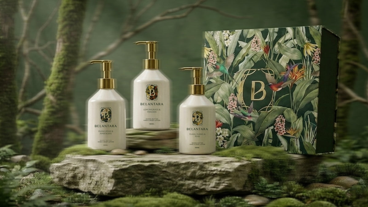 Set of three Belantara Mango Butter Hand & Body Lotion Bottles and a green floral-patterned gift box with the Belantara logo on a natural background.