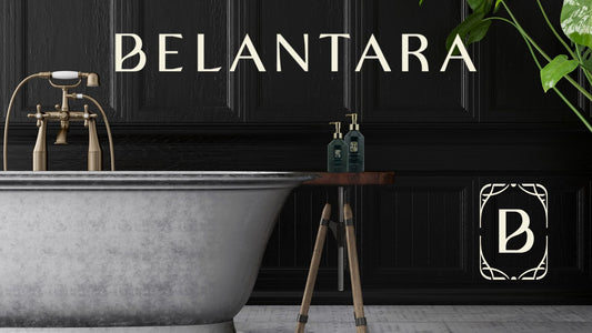 A luxury bathroom setting showcasing a standalone bathtub, tropical plants and two bottles of the Belantara Mango Butter Hand & Body Wash.
