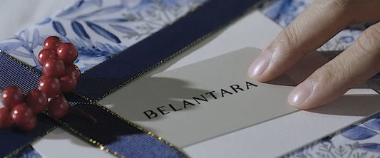 A Belantara gift card on a Christmas present.