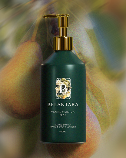 Green bottle with gold pump of Belantara Mango Butter Hand & Body Cleanser in Ylang Ylang & Pear fragrance on a textured pear background.